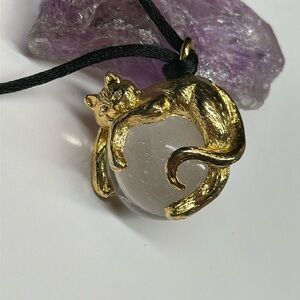 Gold cat on crystal orb marble pendant necklace on black silky cord